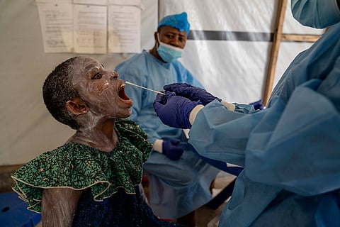 Mpox outbreak: A health worker takes a saliva sample from a patient in Congo
